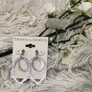 Draper’s and Damon’s silver earrings